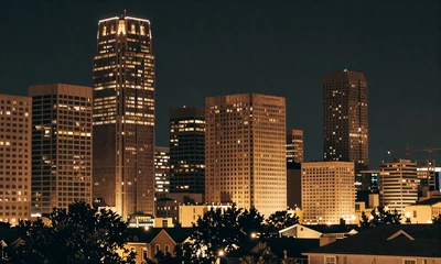 Houston downtown skyline at night with warm lights for local dating platform